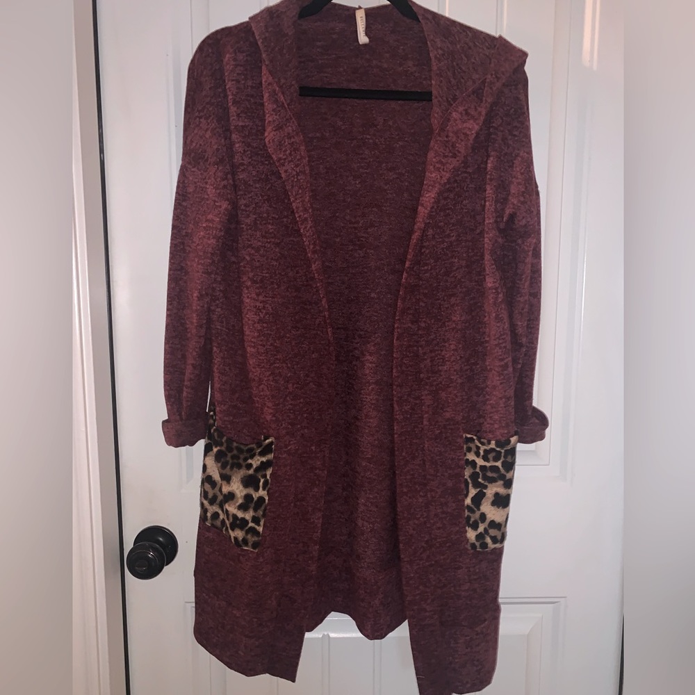 Women’s Cardigan burgundy with hood and leopard pockets.